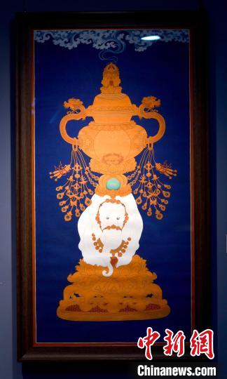 圖為5月16日，展覽中的新創(chuàng)唐卡作品《瑞象承香》?！±盍?攝